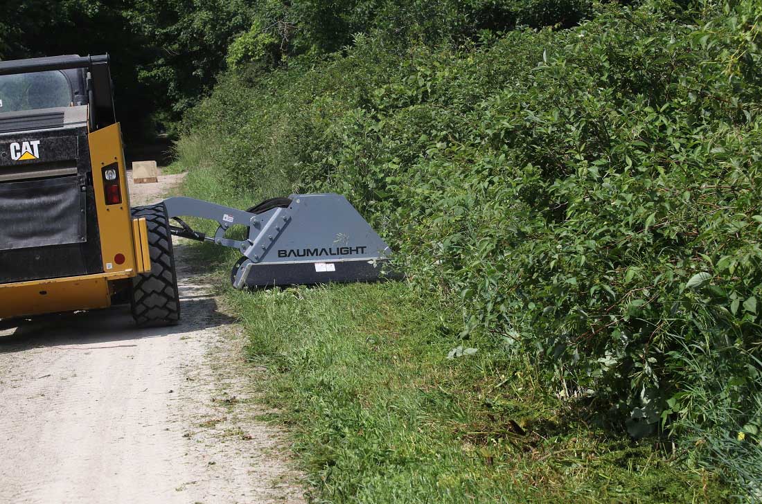 Trail maintenance with cat skidsteer