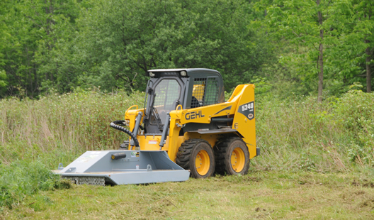 Skidsteer mounted Baumalight BrushCutt CF372 getting ready for clearing