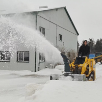 Snow blower on tracked loader