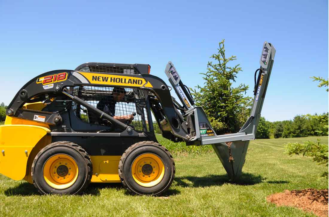 Baumalight 24 inch tree spade on new holland L218 skidsteer