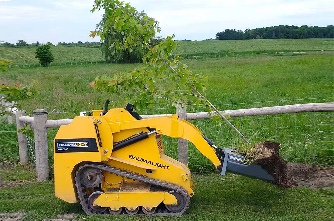 Un louchet à arbre pour un chargeur compact